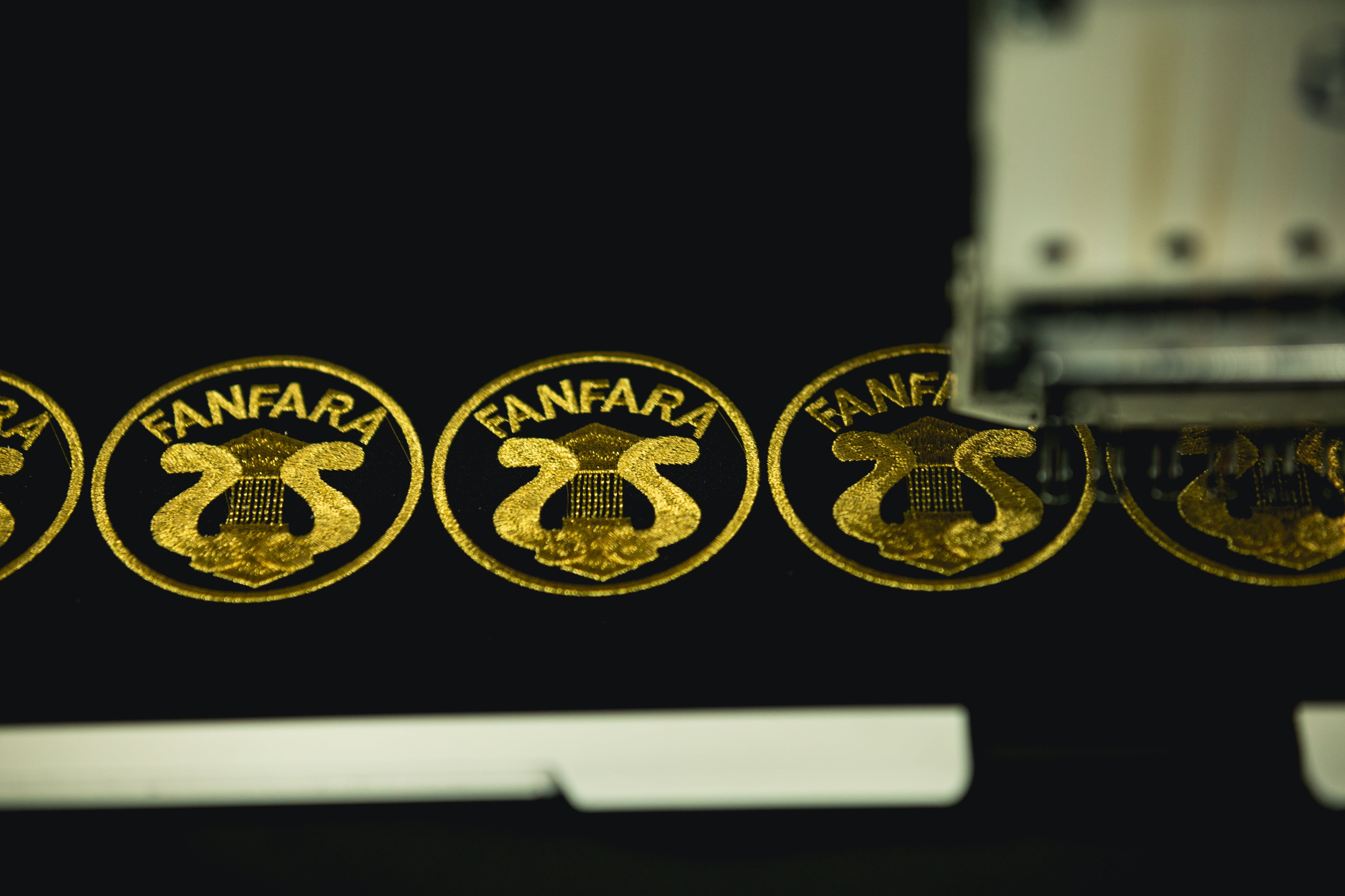 EMBROIDERY SERVICE GOLDEN ON BLACK BY TRICOTUR